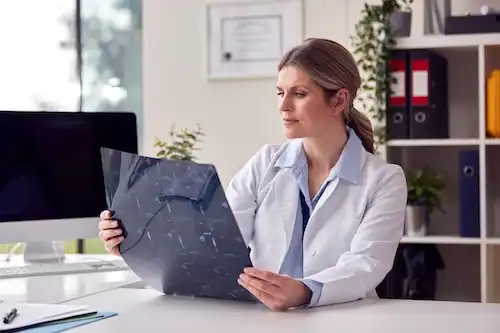 Raleigh car accident lawyer Eric Mogy reviewing orthopedic medical records to build a car accident injury claim in North Carolina