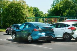 Auto accident compensation case involving a multi-vehicle rear-end collision with significant property damage.