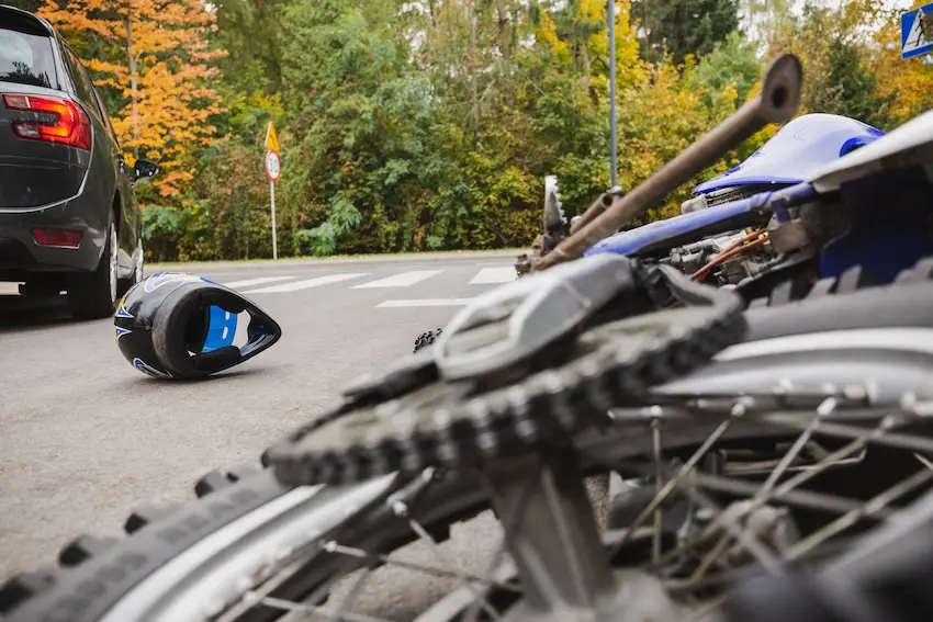 Damaged motorcycle after crash showing severe impact requiring motorcycle accident lawyer investigation and insurance claim