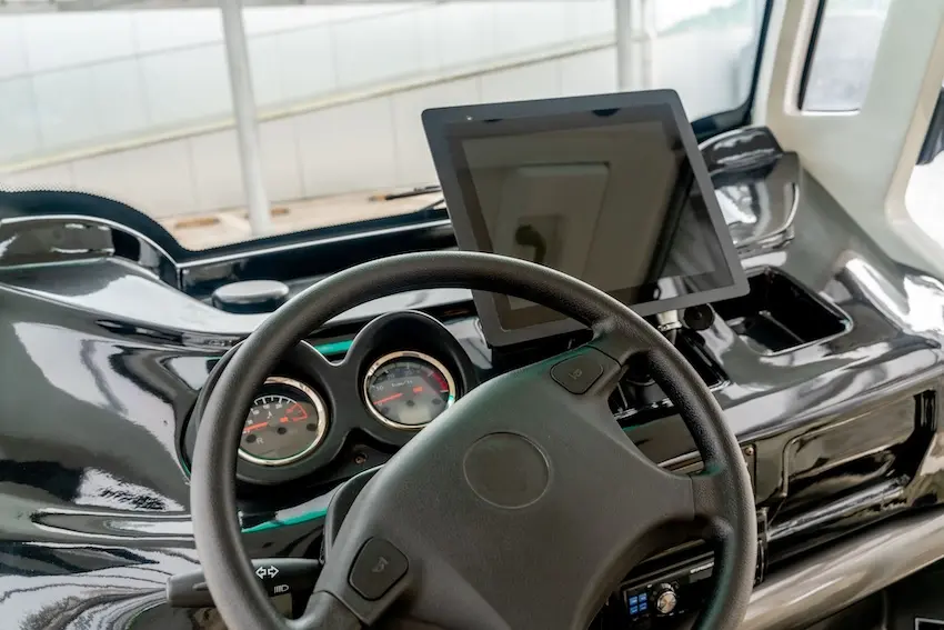 Electronic logging device in commercial truck cab showing FMCSA hours of service compliance data relevant to North Carolina truck accident cases