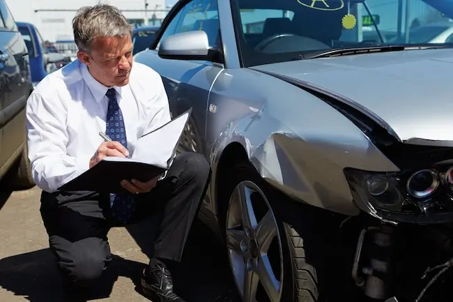 Adjuster Assessing Damages