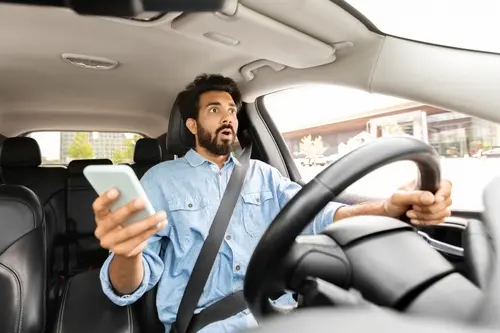 Man On Phone While Driving